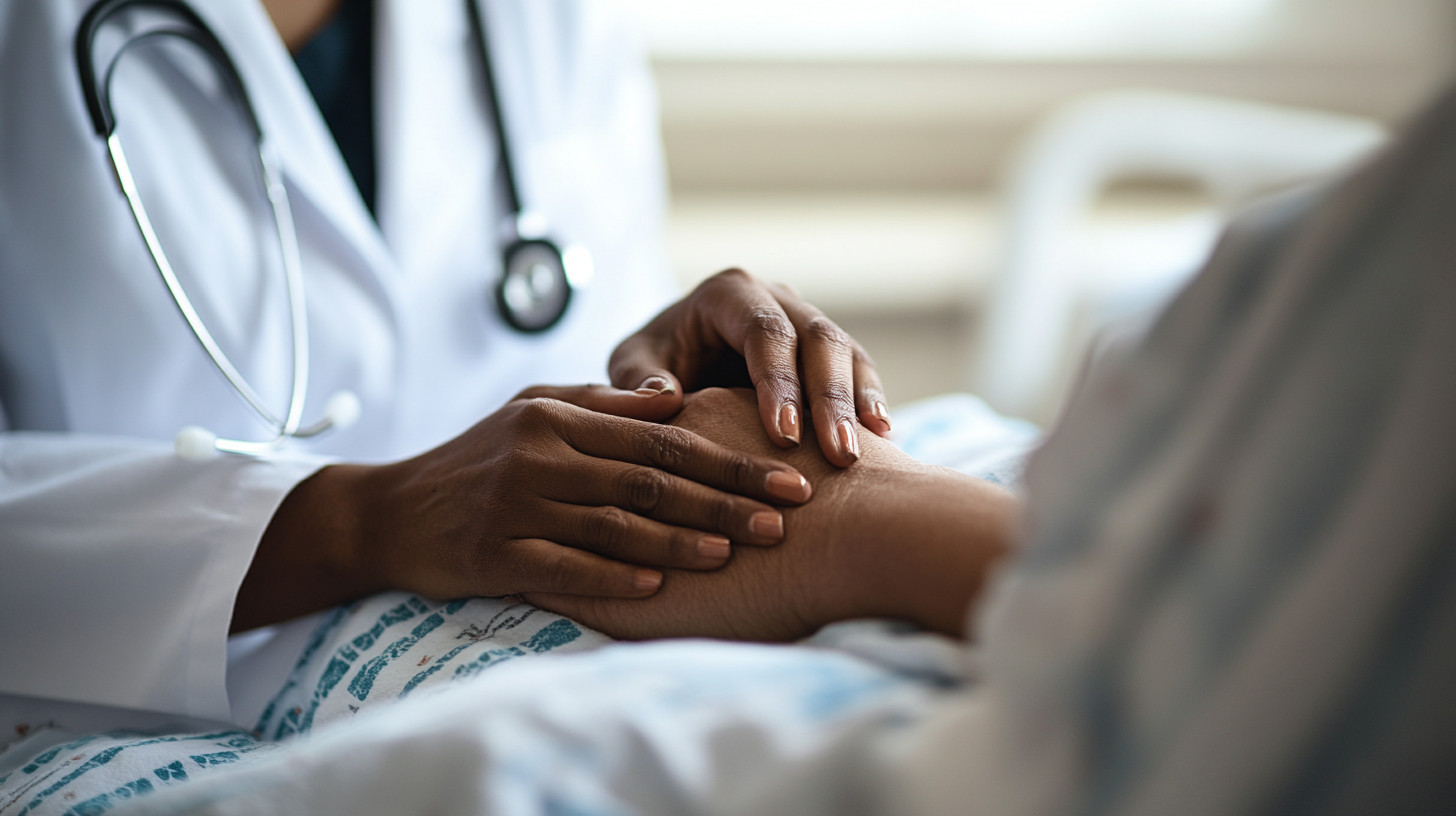 A clinician's hands resting open beside an ultrasound image of a sixteen-week pregnancy with a subchorionic hematoma — the bedside moment when the medicine has limits and the care does not.